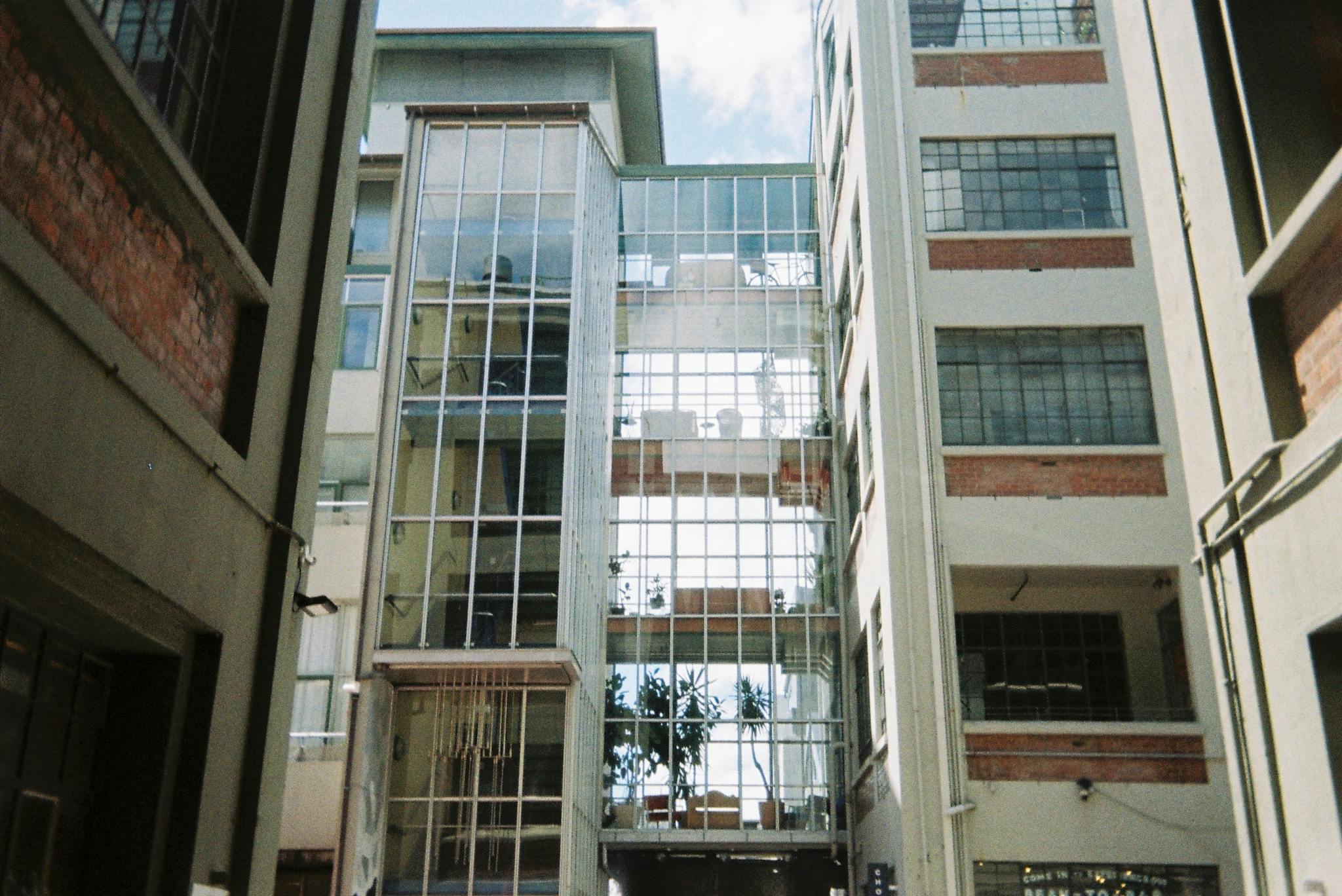 Modern urban architecture showcasing glass facades in Wellington, New Zealand.